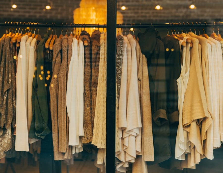 Freshly cleaned garments hanging in the bright Fresh Press facility