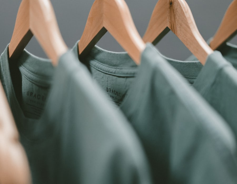 A freshly pressed suit on a steamer at Fresh Press